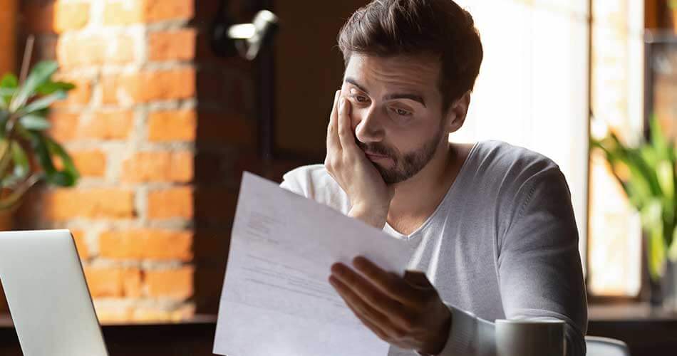 Man looks at repossesion notice and wonders how long it will stay on his credit report