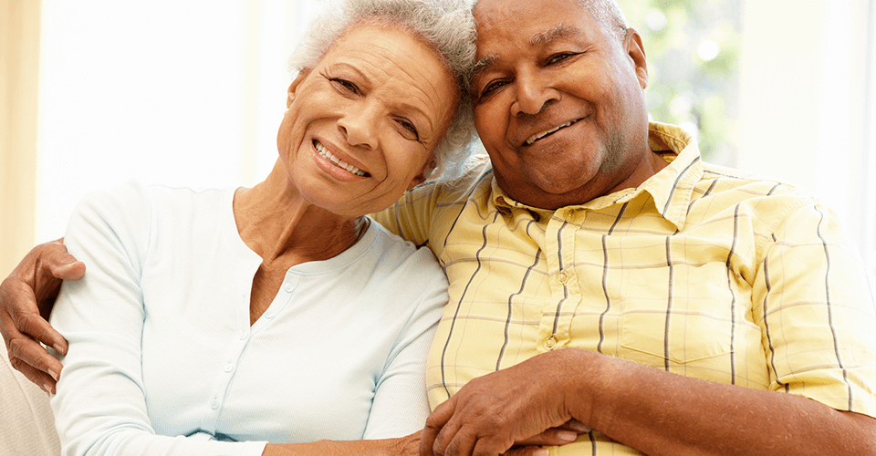 An elderly couple happy because they got out of their reverse mortgage