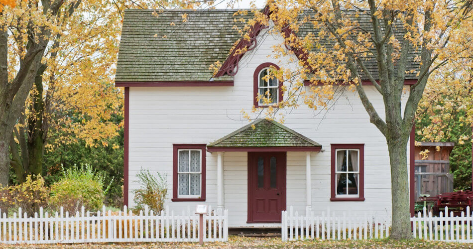 home with white-picket fence and autumn leaves, purchases with conforming mortgage loan