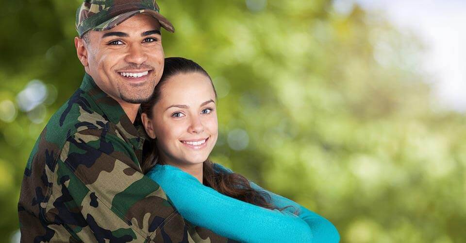 Military member and partner happy because they got a VA loan
