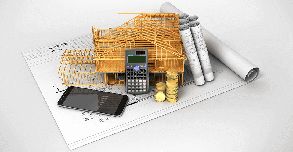 Image of house plans, a calculator, and money to symbolize the idea of financing a new construction home