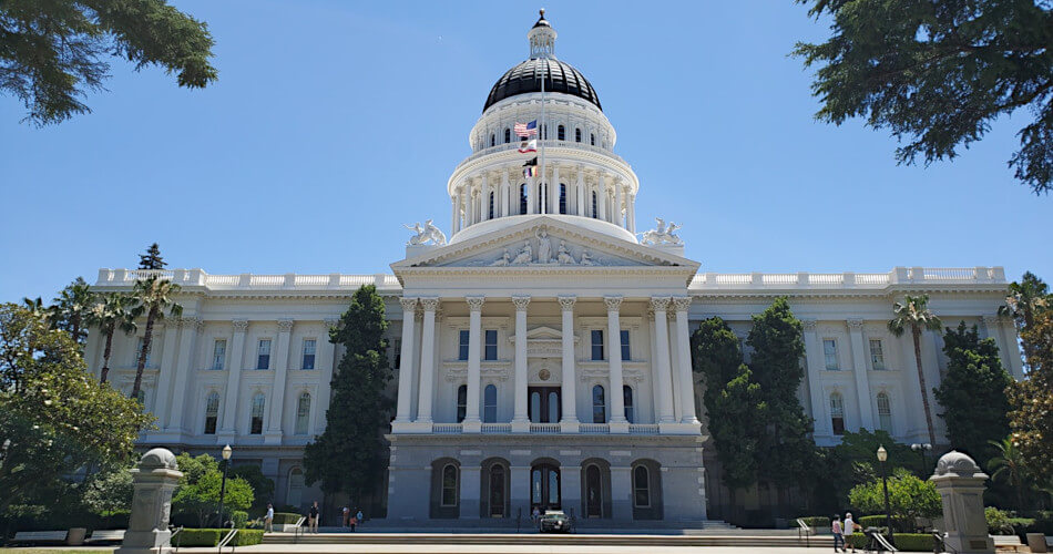 The California State Capitol building, clear blue sky, some trees