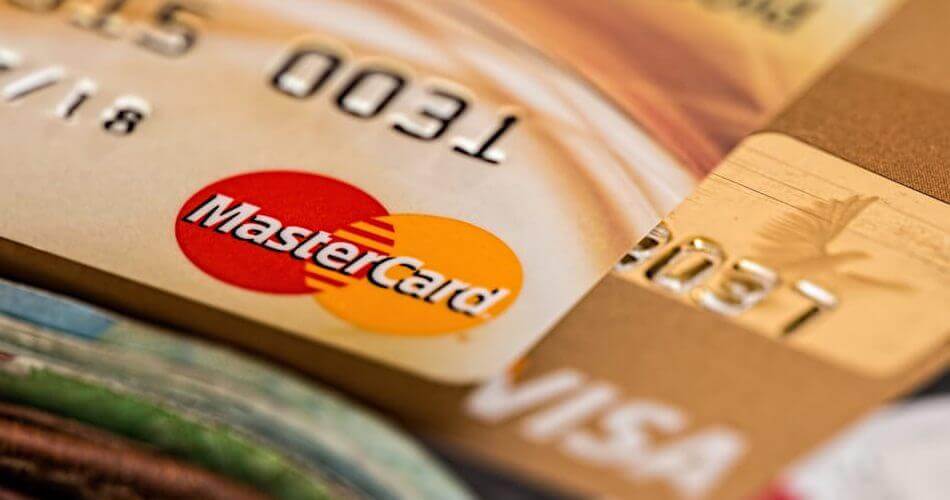 Close-up of a MasterCard on top of a Visa card