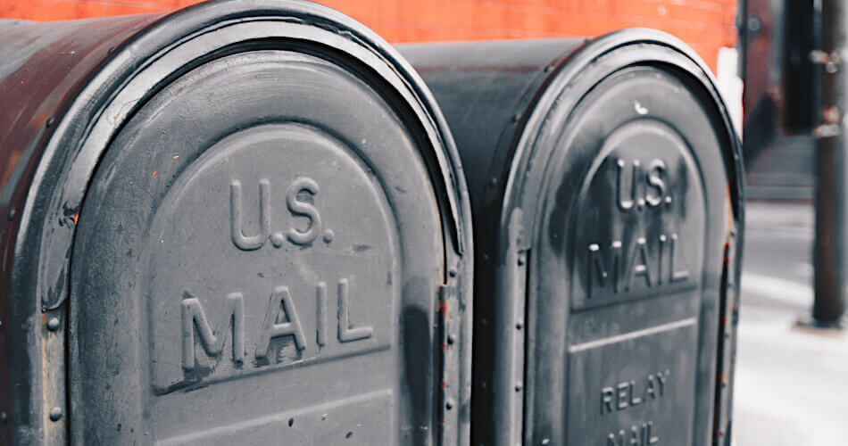 Two metal U.S. Postal Service mailboxes