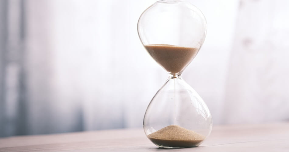 an hourglass representing time running out