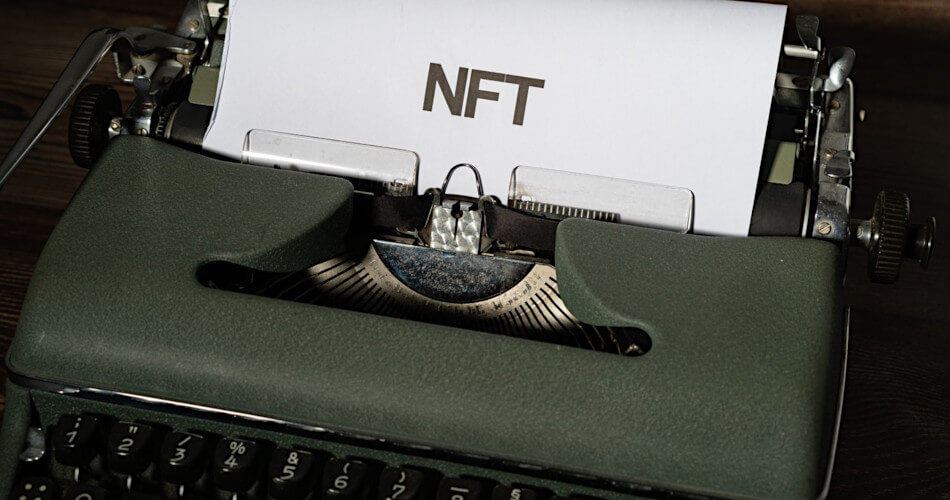 Paper in a typewriter with NFT in large letters