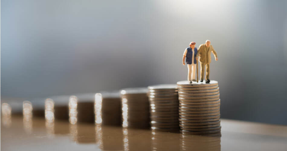 Figures of an elderly couple standing on top of coin stacks, representing pension income
