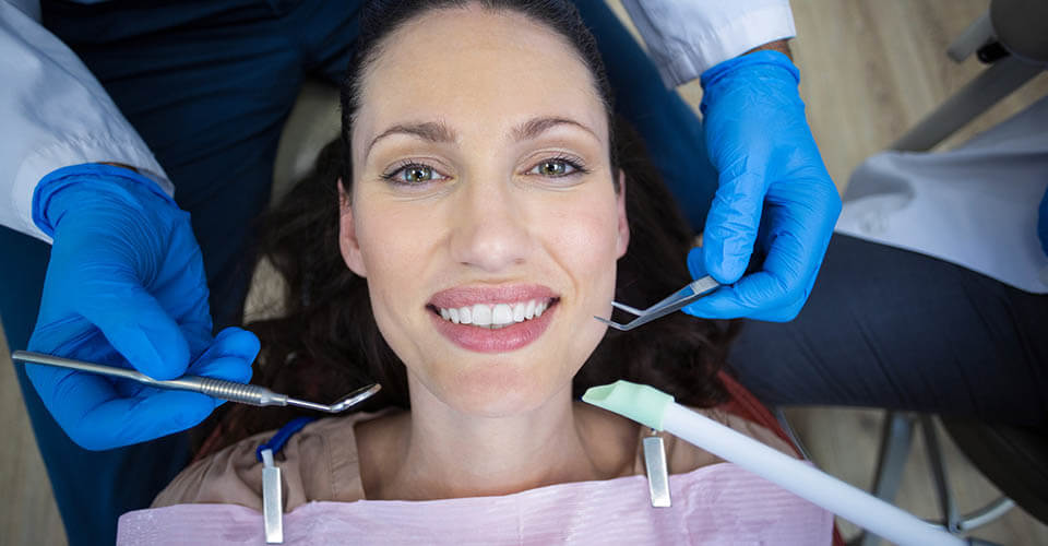 Woman having dental work done