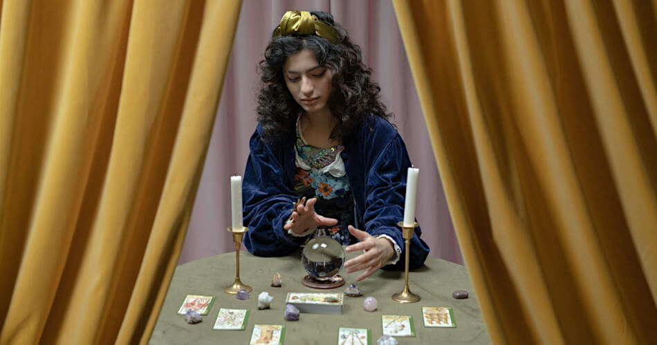 Fortune teller with crystal ball and tarot cards