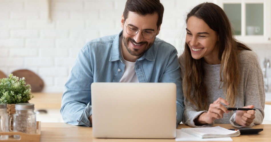 Couple reviewing their budget with one person working a $74k/year job
