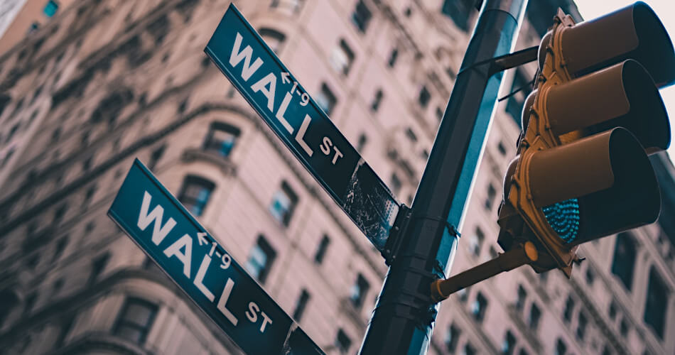 Street signs reading Wall Street
