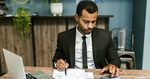 Appeals officer reviewing appeals paperwork from a taxpayer who learned how to fight the IRS and win