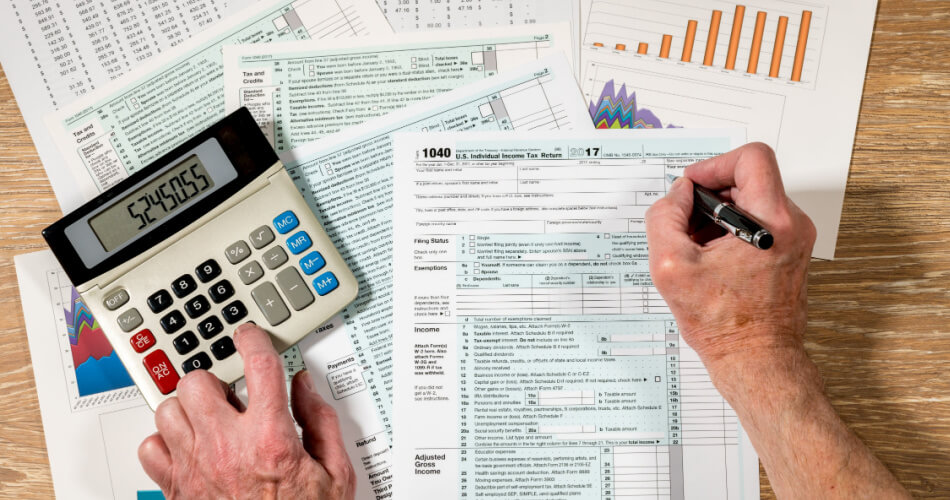 Man calculating his tax debt since he knows he can't avoid paying the IRS back taxes