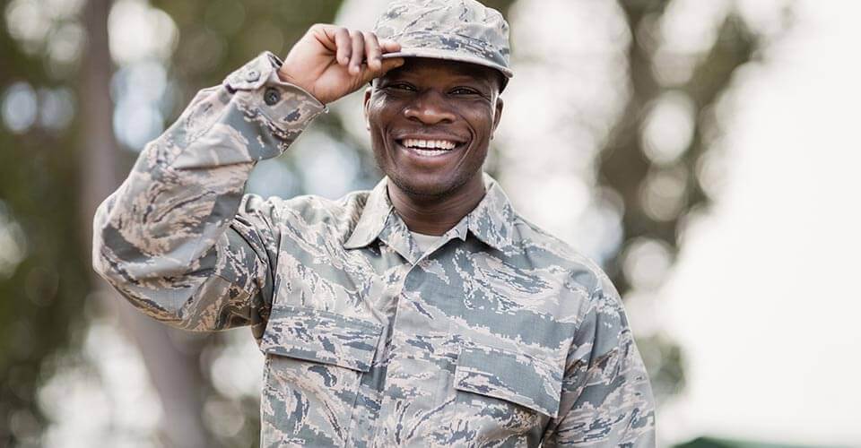 Military service member in uniform smiling