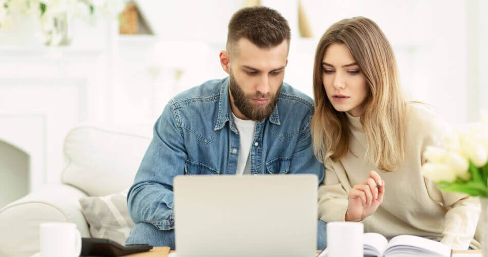 Couple reviewing their options for a personal loan with the best interest rate