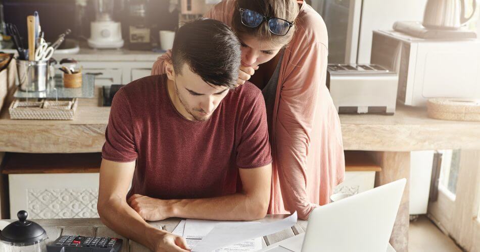 Couple reviewing current interest rates on savings accounts