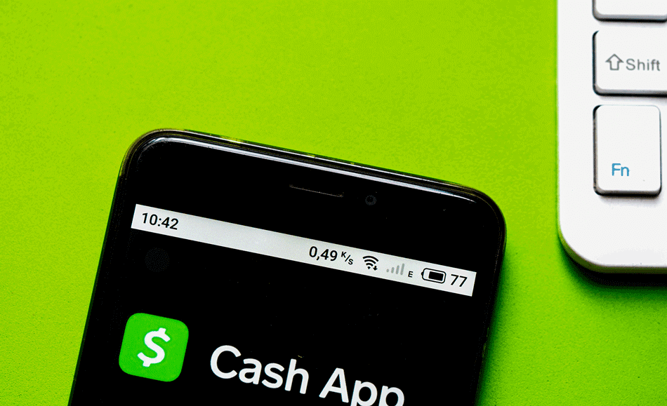 Smartphone showing the Cash App logo over a green background
