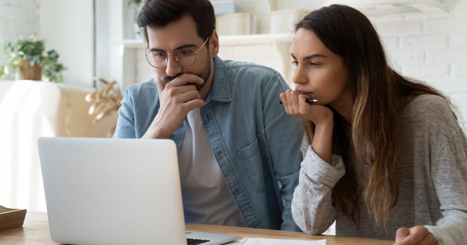 Couple reviewing current savings account rates