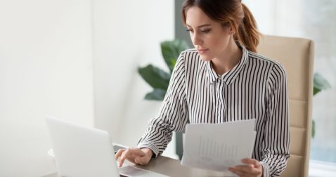 Young woman reviewing the pros and cons of personal loans
